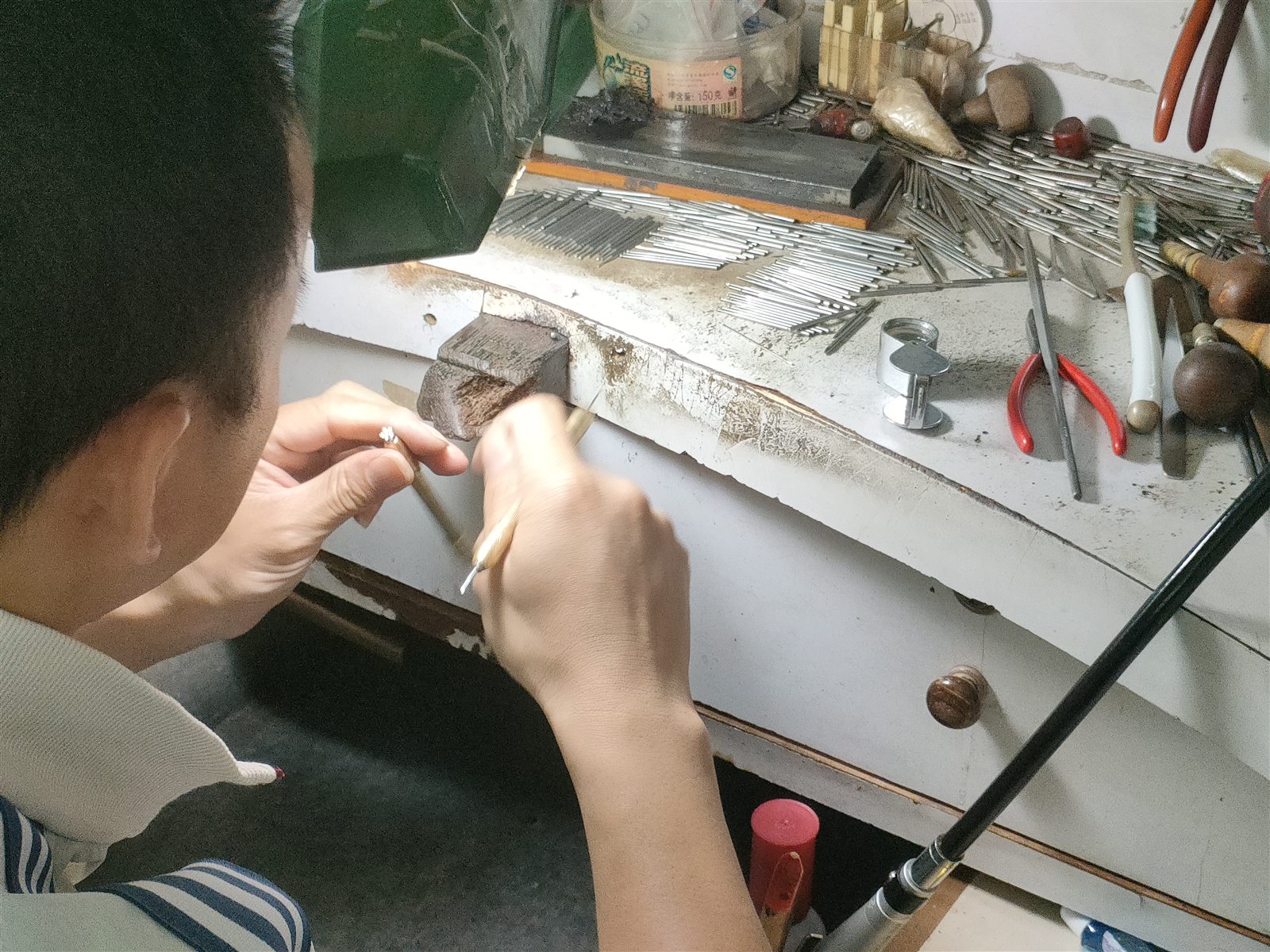 Jeweler working at the bench